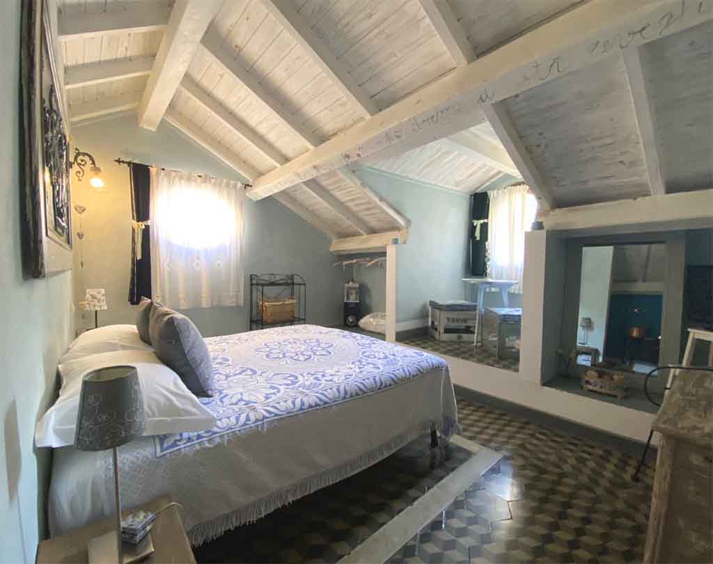 Les Romantique double bedroom with sloping ceilings